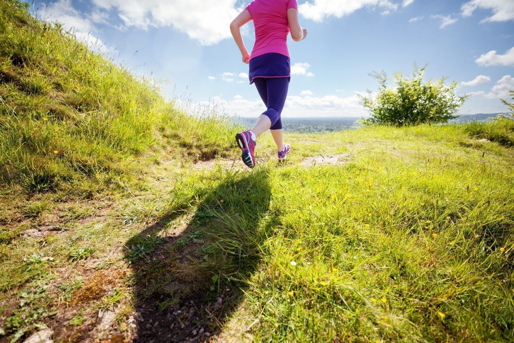 woman trail running