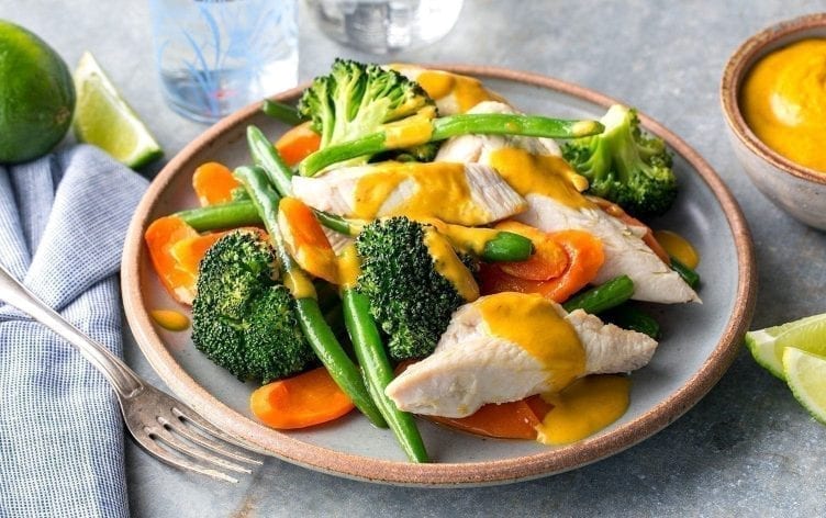 Poached Chicken With Steamed Veggies and Peanut Sauce